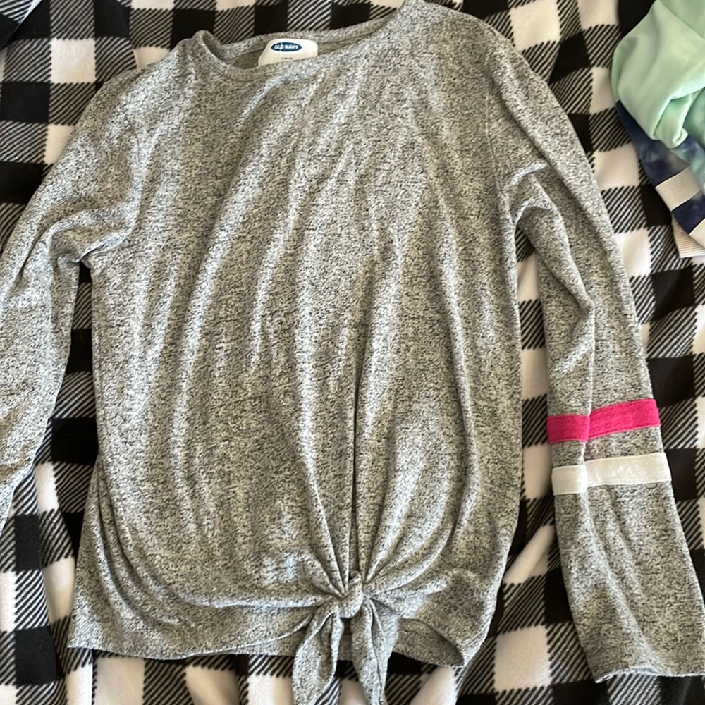 Long sleeve top with bow at the bottom